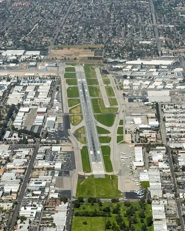Aerial view of the Van Nuys Airport runway surrounded by the San Fernando Valley